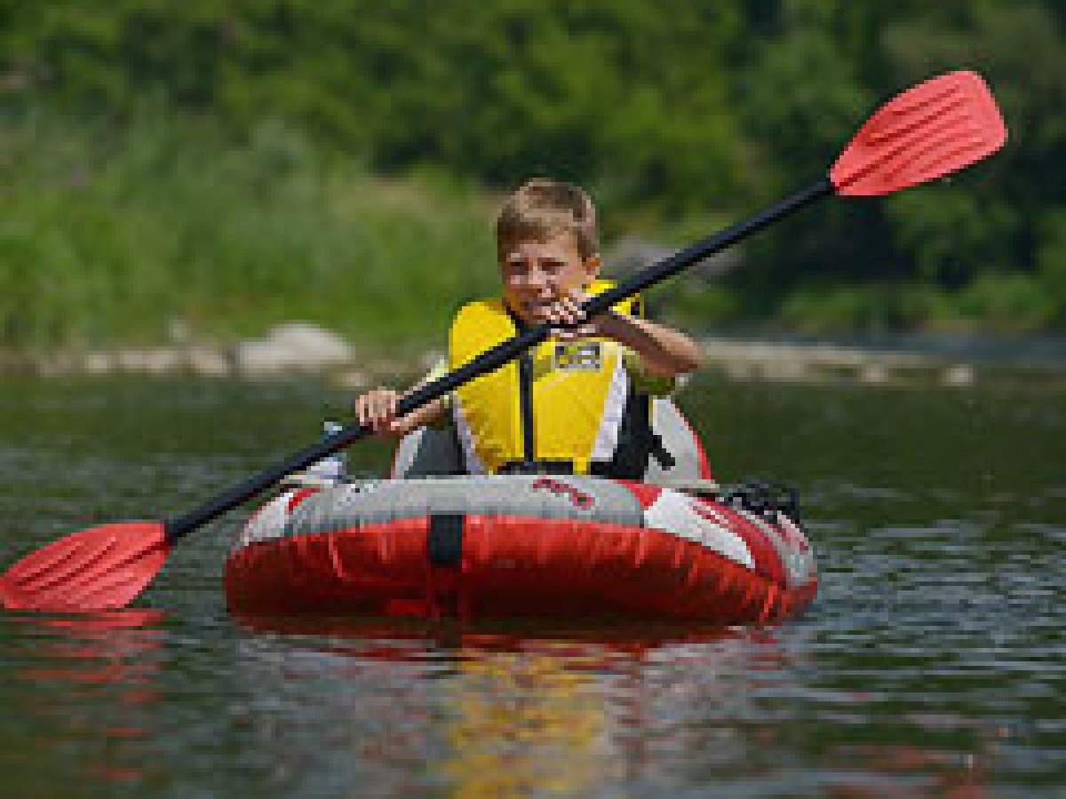 a person rowing a boat in the water
